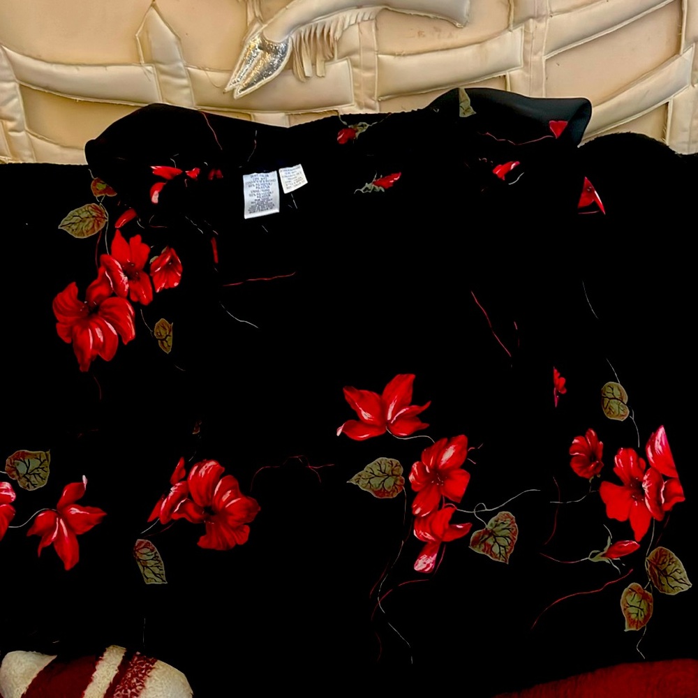 Woman’s tall size 12 black floral skirt.  Elastic waist with flair bottom, slip.